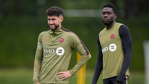 Canada's Jonathan Osorio, left, and Alphonso Davies, right, participate in a World Cup soccer training session in Vancouver, British Columbia, Thursday, June 25, 2026.
