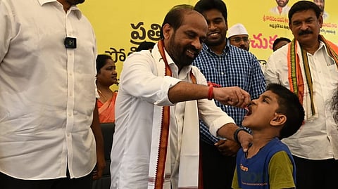 Andhra Pradesh Health Minister Satya Kumar Yadav administers polio drops to a child during the launch of the Pulse Polio immunisation programme on Sunday.