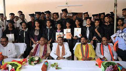 Union Minister Dharmendra Pradhan with other guests and students in Kendrapara.