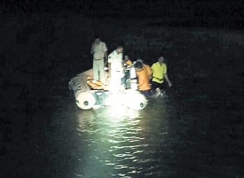 Fire services personnel carrying out search operation on Sunday 