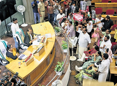 LDF councillors protesting in front of Mayor V V Rajesh during the corporation council meeting on Monday 