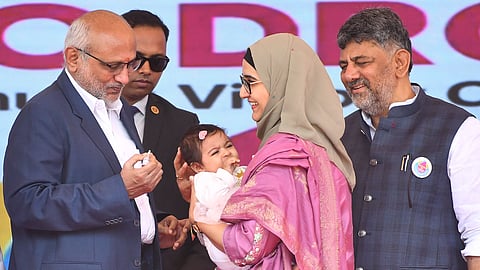 Vice-President CP Radhakrishnan administers polio drops to a child as part of the nationwide pulse polio programme, at Sree Kanteerava Stadium in Bengaluru 
on Sunday. Chief Minister DK Shivakumar looks on.