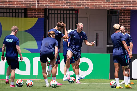 Norway's Erling Haaland, center, talks with staff and teammates as they participate in a training session in Dallas, Monday, June 29, 2026, ahead of his team's FIFA World Cup match against the Ivory Coast. 