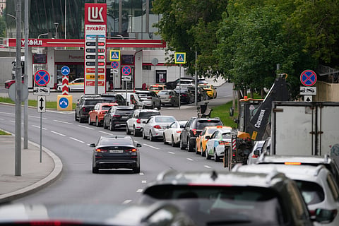 Cars line up at a Lukoil gas station in Moscow, Monday, June 29, 2026