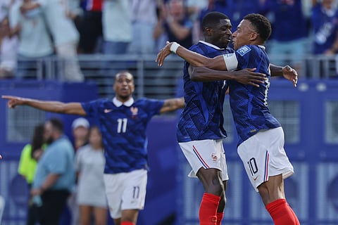 France's Kylian Mbappe (10) celebrates their first goal with Ousmane Dembele, left, during the World Cup round of 32 soccer match between France and Sweden in East Rutherford, N.J., near New York, Tuesday, June 30, 2026. 