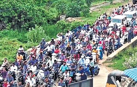 A bike rally being taken out by workers at the Yadadri Thermal Power Plant in Veerlapalem in Damaracherla mandal on Tuesday