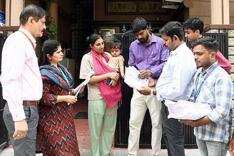 Officials involved in SIR process in Mysuru on Tuesday.