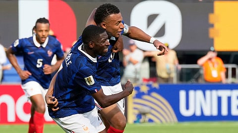 France's Kylian Mbappe, right, celebrates with his teammate after scoring his side's opening goal during the World Cup round of 32 soccer match between France and Sweden in East Rutherford, N.J., near New York, Tuesday, June 30, 2026. 