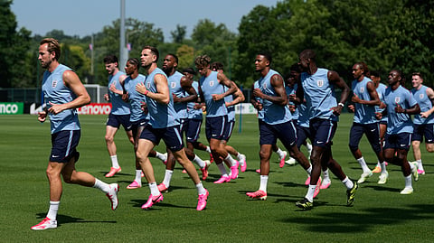 England's Harry Kane, right, runs with teammates during training for the World Cup soccer tournament Tuesday, June 30, 2026, in Kansas City, Mo.