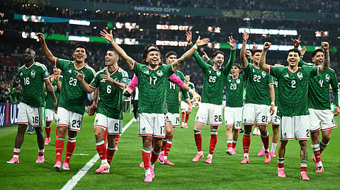 Mexico's players celebrate after winning the 2026 World Cup round of 32 football match between Mexico and Ecuador at the Mexico City Stadium in Mexico City on June 30, 2026.