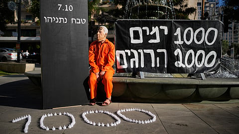 A demonstrator wearing a mask depicting Israeli Prime Minister Benjamin Netanyahu during a protest marking 1,000 days since the Oct. 7, 2023, Hamas-led attack on Israel, in Jerusalem, Thursday, July 2, 2026.