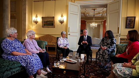 Britain's Prime Minister Keir Starmer, center, attends a meeting with campaigners to discuss historical forced adoption, at Downing Street, in London, Thursday, July 2, 2026. 