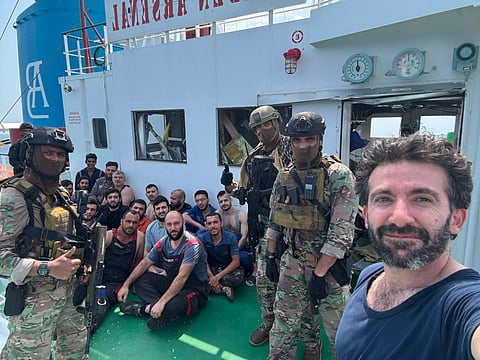 The 21 crew members had locked themselves inside the ship’s citadel and were reported safe.