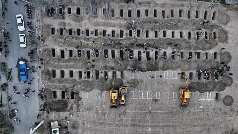 This picture, released by the Iranian government's foreign media department and distributed by the AP without changes, shows graves being prepared for the victims, mostly children, of a strike Feb. 28 on a primary school in Minab, Iran, Monday, March 2, 2026.
