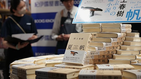 Bookstore staff prepare a countdown event for their customers to receive copies they pre-purchased, of author Haruki Murakami's new book titled "The Tale of Kaho," at the Kinokuniya bookstore in Tokyo, Thursday, July 2, 2026. 
