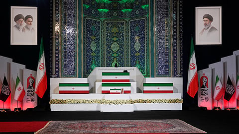 The coffins of slain Iranian Supreme Leader Ayatollah Ali Khamenei, center on top, and members of his family, including his granddaughter Zahra Mohammadi Golpayegani, are displayed ahead of the dayslong funeral ceremonies at the Imam Khomeini Mosalla Grand Mosque in Tehran, Iran, Friday, July 3, 2026.