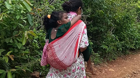 Warden carries fever-stricken girl on her back for six km for medical treatment in Parvathipuram-Manyam district 
