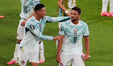Goncalo Ramos (R) and Cristiano Ronaldo celebrate Portugal's second goal