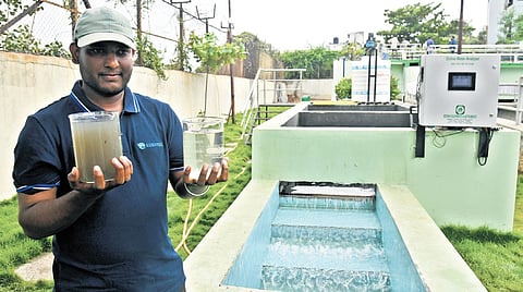 An official shows the difference between treated and untreated water after it is processed by the Japanese Bio-Lace technology in Hyderabad on Friday.