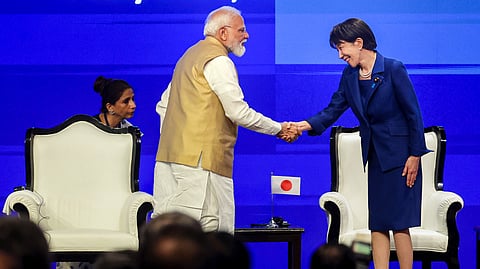 Prime Minister Narendra Modi greets Japanese Prime Minister Sanae Takaichi during the India-Japan Joint Economic Forum, in New Delhi. 
