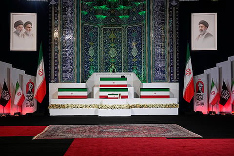 The coffins of slain Iranian Supreme Leader Ayatollah Ali Khamenei, center on top, and members of his family are displayed ahead of the dayslong funeral ceremonies at the Imam Khomeini Mosalla Grand Mosque in Tehran, Iran, Friday, July 3, 2026