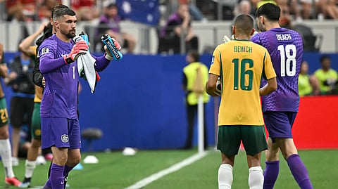 Australia's goalkeeper #18 Patrick Beach (R) is substituted by Australia's goalkeeper #01 Mathew Ryan during the 2026 World Cup round of 32 football match between Australia and Egypt at the Dallas Stadium in Arlington on July 3, 2026.