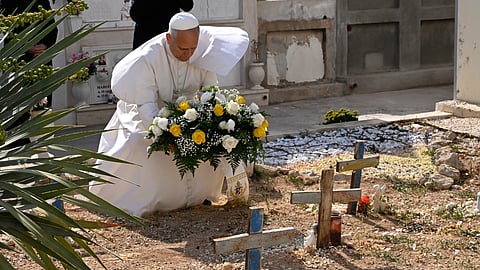 Pope Leo XIV pays tribute at the cemetery and on little Joussef's grave, in Lampedusa, Sicily, southern Italy, Saturday, July 4, 2026, during a one-day pastoral visit to an island that has become a symbolof the risks faced by migrants trying to reach Europe by sea.