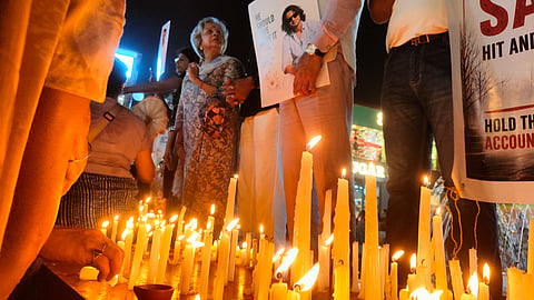 Gurugram locals hold candle march, seek justice for Rajokri crash victim.