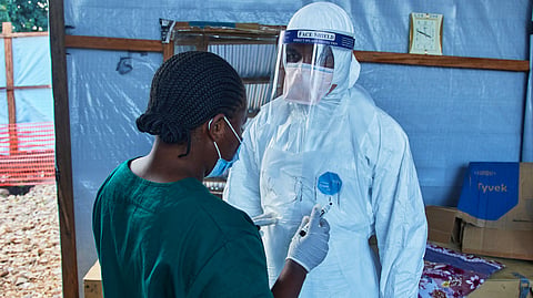 Health workers interact at the Evangelical Medical Center, in Bunia, eastern Congo, Friday, July 3, 2026, where Ebola clinical trials are scheduled to take place.