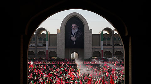 Mourners attend funeral prayers held as part of the dayslong funeral service for the slain Iranian Supreme Leader Ayatollah Ali Khamenei and members of his family at the Imam Khomeini Mosalla Grand Mosque in Tehran, Iran, on Sunday, July 5, 2026.