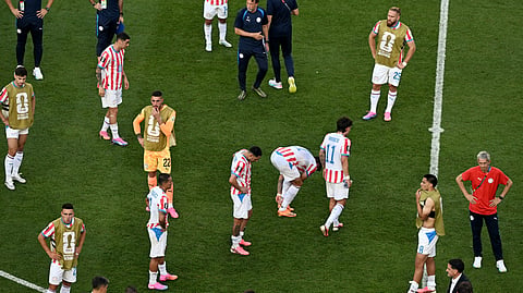 Paraguay players react after losing the 2026 World Cup round of 16 football match between Paraguay and France at the Philadelphia Stadium in Philadelphia on July 4, 2026. 