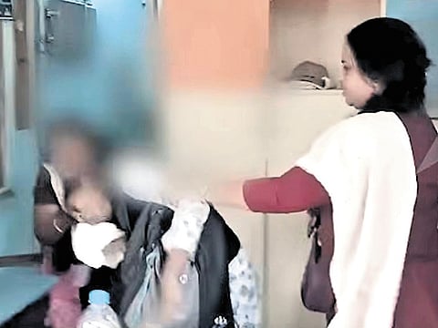 A screen grab of the scuffle between the advocate and two railway officials