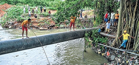 Fire services personnel engaged in search operation to trace Anil Singh who was swept away in the drain near Vani Vihar, on Sunday 