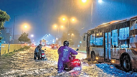 Commuters stuck on the waterlogged national highway near Panchgochhia