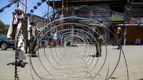 Security beefed up during an anti-terror operation, in Shopian district, Jammu and Kashmir, Sunday, July 5, 2026. The searches have been resumed to track down the two terrorists who were spotted by surveillance cameras on Friday in an orchard in the Meemandar area, which comprises seven villages.
