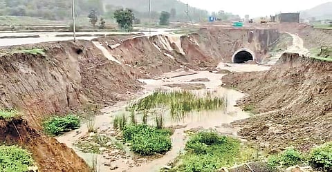Rainwater and silt accumulated outside the under-construction railway tunnel