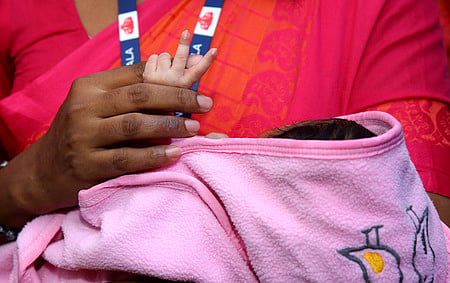 Child Welfare Committee officials receive an abandoned newborn from the Special Newborn Care Unit (SNCU) of Ernakulam General Hospital