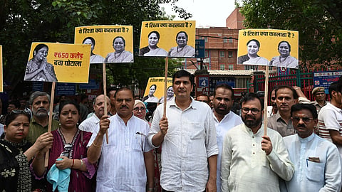Delhi AAP leaders and others, stages a protest outside the LNJP Hospital over the alleged Rs 650 crore medicine and medical equipment procurement scam in the Delhi government's Health Department, in New Delhi on Monday.Express Photo