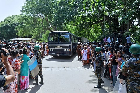 A crowd of people wait outside a prison where deadly clashes broke out on Sunday, in Negombo, 35 kilometres north of the capital Colombo, Sri Lanka, Monday, July 6, 2026.