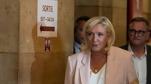Far-right leader Marine Le Pen arrives at the courtroom for the verdict of her appeals trial in Paris, France, Tuesday, July 7, 2026.