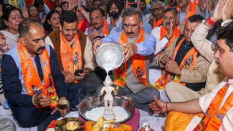 Himachal Pradesh Chief Minister Sukhvinder Singh Sukhu and others offer prayers at a temple, in Shimla, Himachal Pradesh, Tuesday, July 7, 2026. 