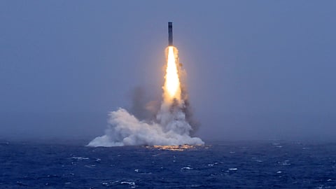 In this photo released by Xinhua News Agency, a long-range ballistic missile bursts out of the sea during a test launched from a Chinese nuclear-powered submarine in the South Pacific on Monday, July 6, 2026.