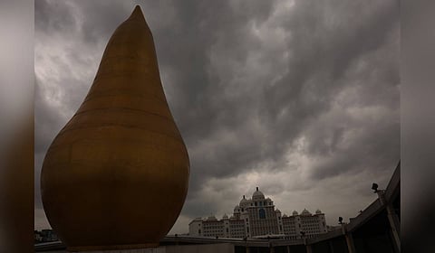 Dark clouds loom over the sky at Martyrs’ Memorial and Secretariat in Hyderabad 
on Monday.