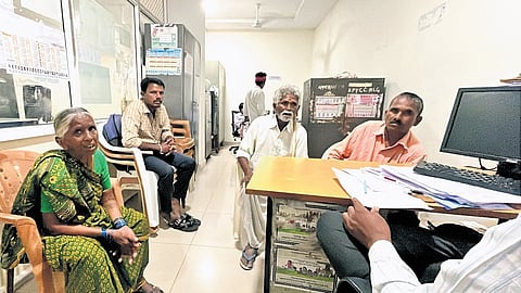 An official holds a counselling session for the sons of an aged couple at the District Welfare Office in Nalgonda on Monday.