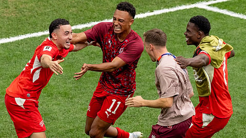 Switzerland's Ruben Vargas, left, celebrates with teammates after making the winning kick in a penalty shootout in the World Cup round of 16 soccer match between Switzerland and Colombia in Vancouver, British Columbia, Tuesday, July 7, 2026.