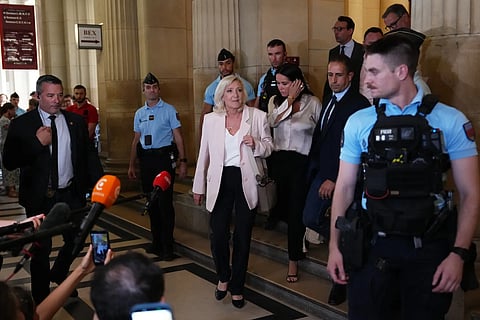 Far-right leader Marine Le Pen leaves the courtroom after the verdict of her appeal trial, in Paris, France, Tuesday, July 7, 2026. 