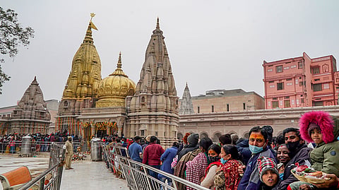 In this photo from Jan. 1, 2022, devotees make their way into the Kashi Vishwanath Temple in Varanasi on New Year's Day.