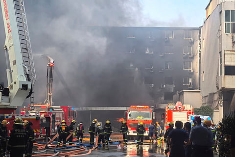 There were 237 factory workers and two visitors in the building when the fire broke out. Authorities pulled out 213 people