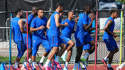 France's Kylian Mbappe (third left)  exercises with his team during a training session ahead of the World Cup quarterfinal soccer match between France and Morocco in Waltham, Mass., near Boston, Wednesday, July 8, 2026.
