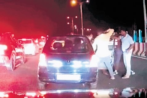 Three persons have been arrested and two others are absconding after a motorist was allegedly dragged out of his car and assaulted in front of his wife and young son near Maddur. 